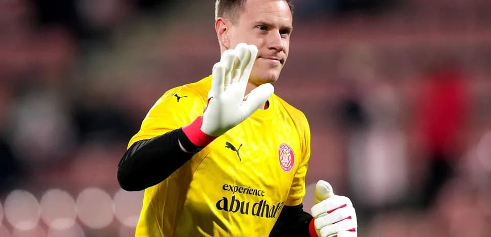 Goalkeeper waving in yellow uniform before match
