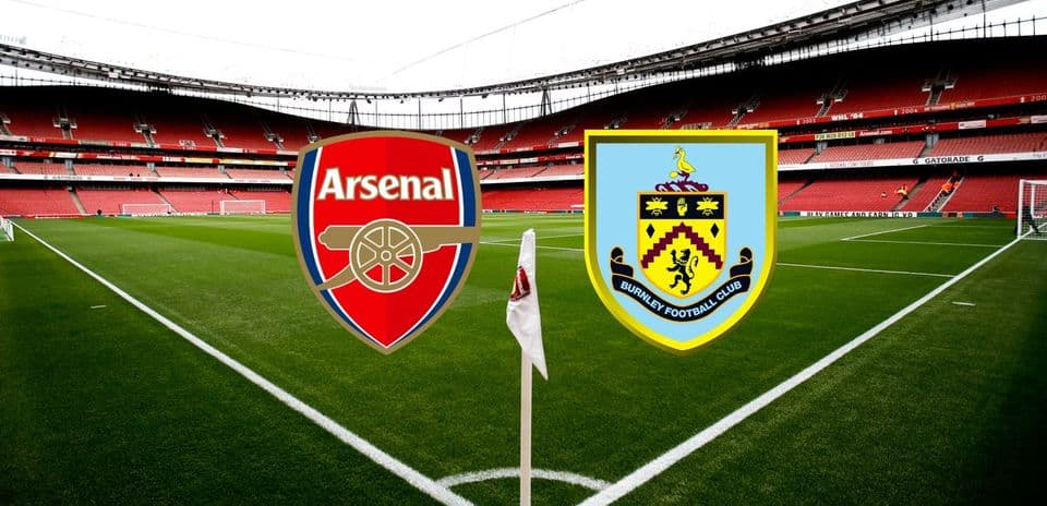 Arsenal and Burnley logos at stadium pitch