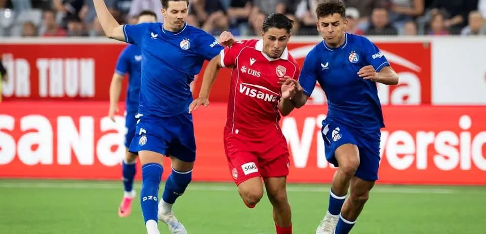 Players competing for the ball during UEFA match