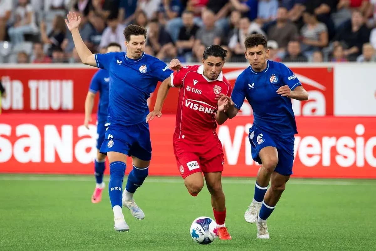 Players competing for the ball during UEFA match
