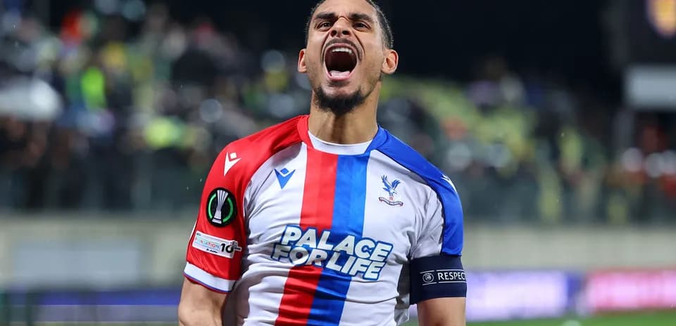Player celebrating passionately in Crystal Palace jersey