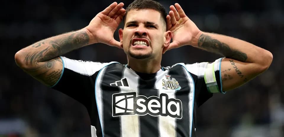 Player celebrating with hands on ears after scoring