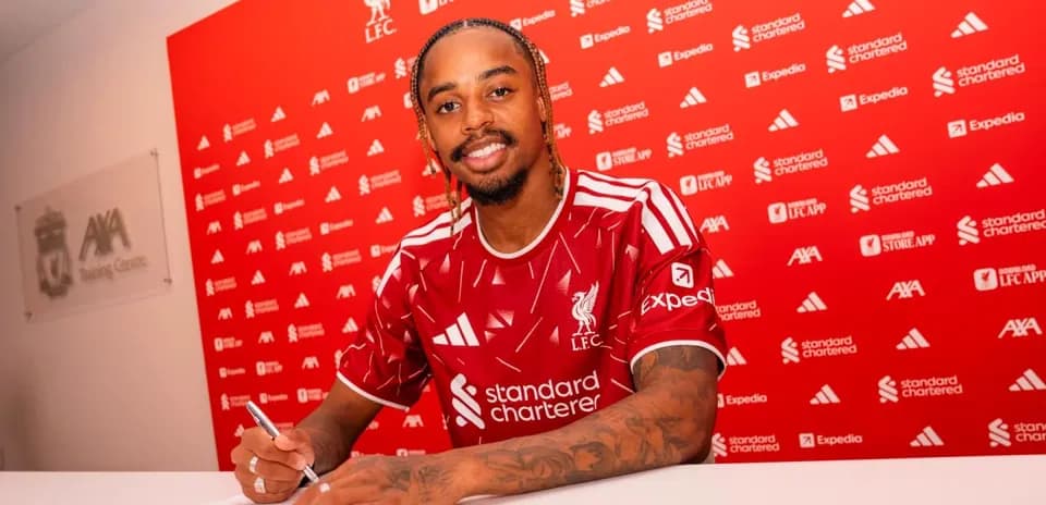 Player signing contract at Liverpool FC press event