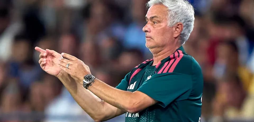 Coach gesturing during a football match