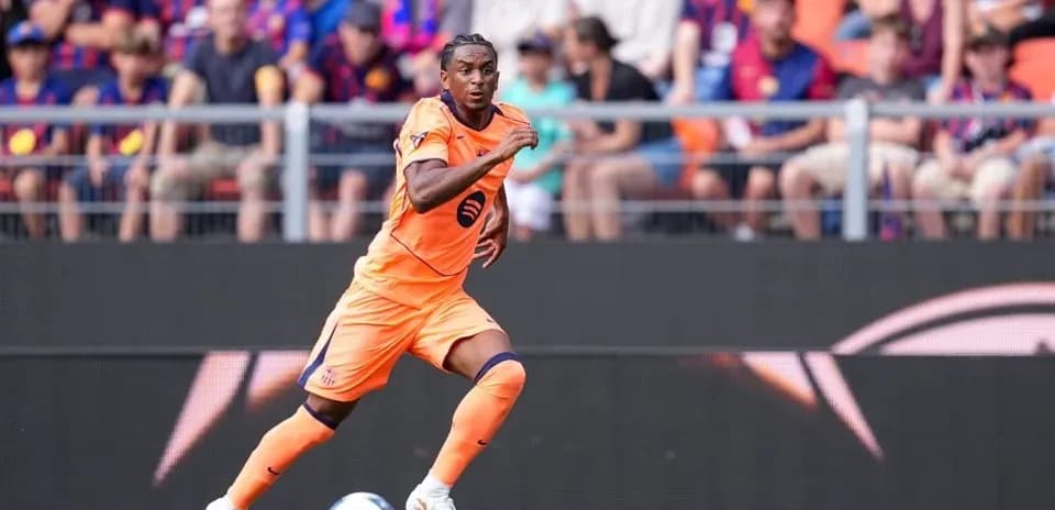 Player in orange uniform sprinting on the field