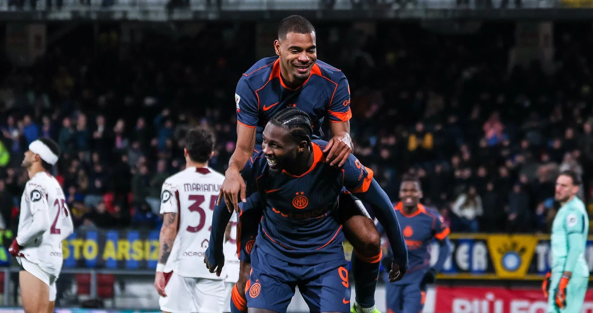 Players celebrating a goal during a match
