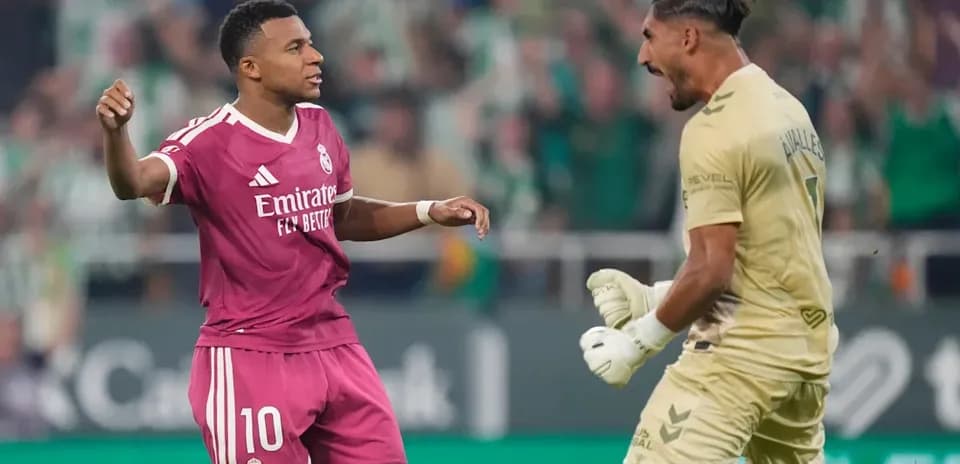 Player celebrating with goalkeeper during match