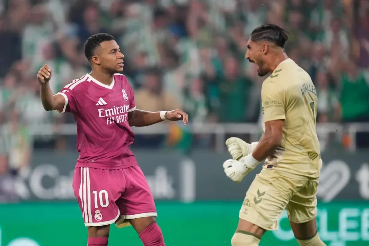 Player celebrating with goalkeeper during match