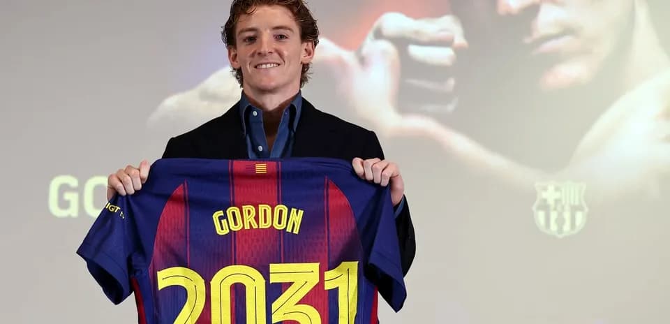 Player holding Barcelona jersey with number 2031