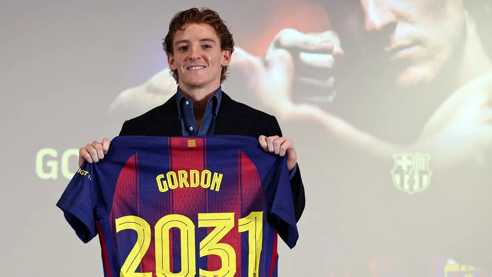 Player holding Barcelona jersey with number 2031
