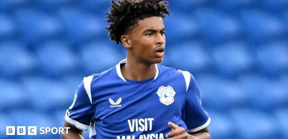 Player in blue kit running on the field