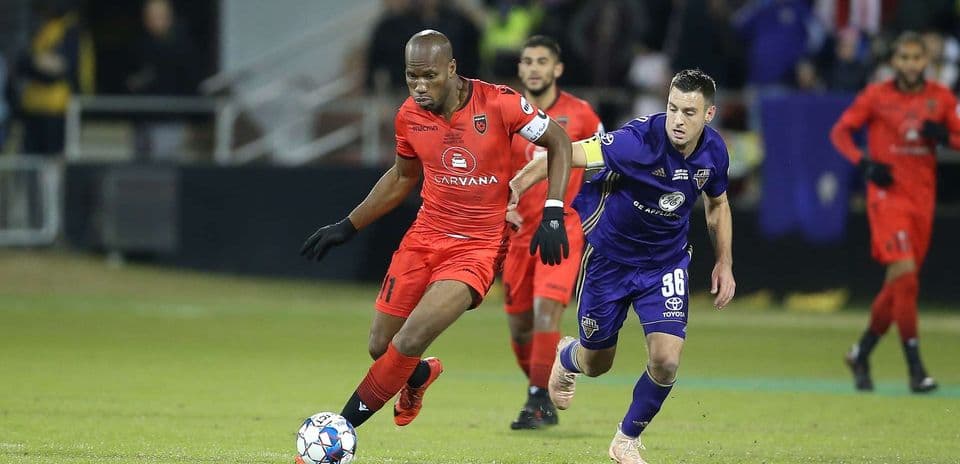 Player dribbling during Phoenix Rising match