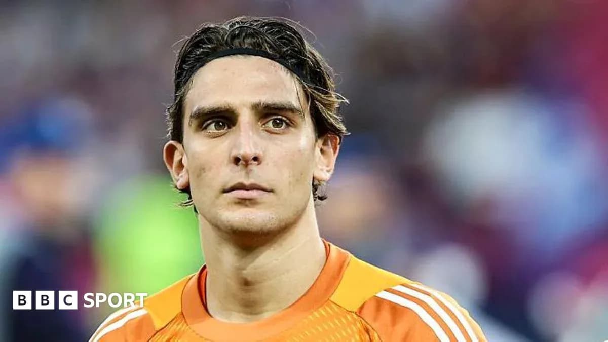 Goalkeeper in orange kit during match
