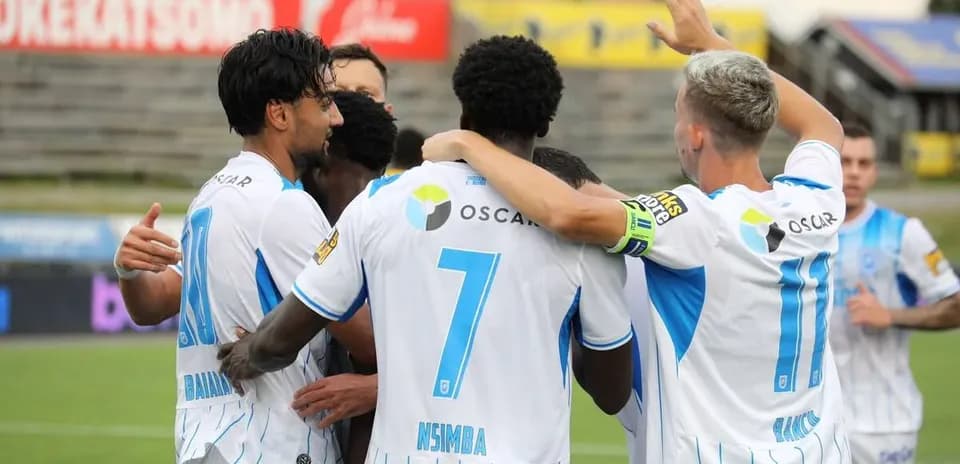Players celebrating a goal during match