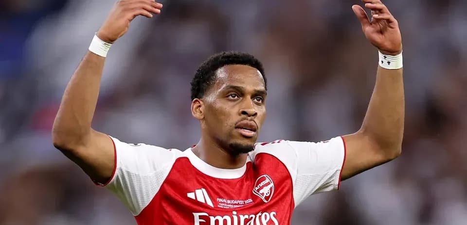 Player gesturing during match in Arsenal jersey