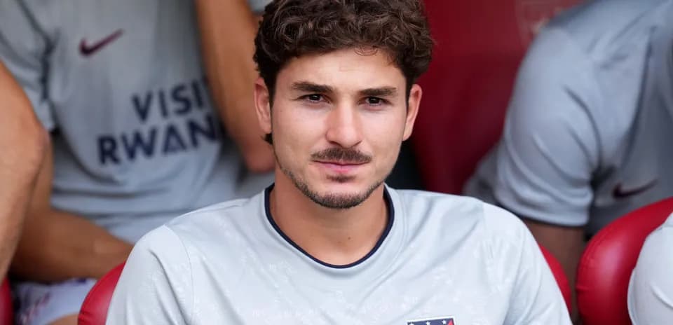 Player seated on bench during a match