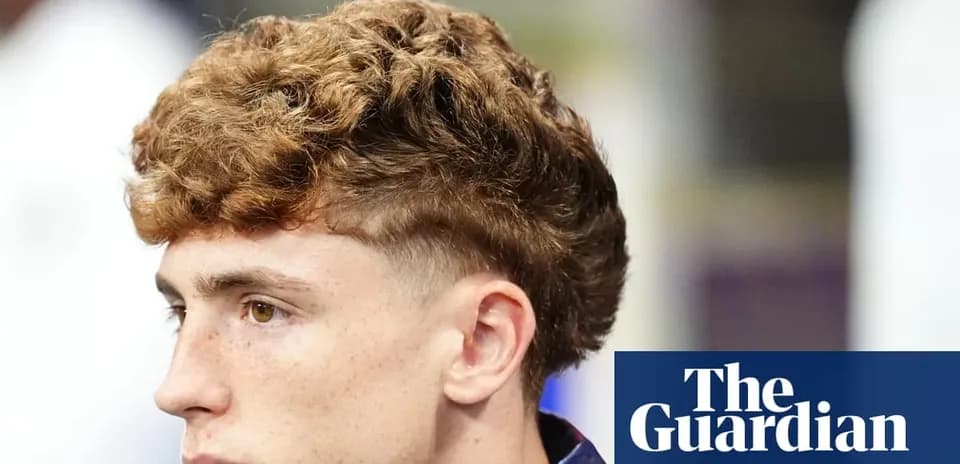 Young man with curly hairstyle looking to the side