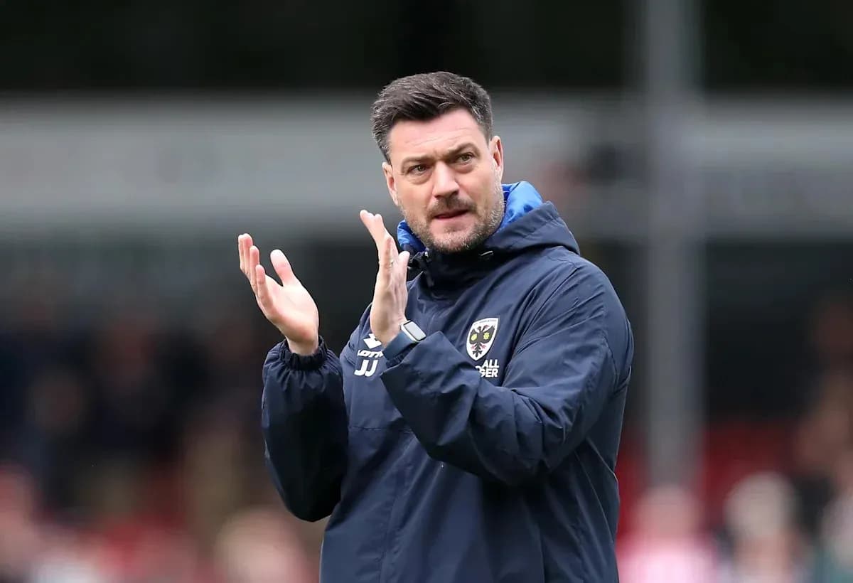 Manager applauding during a football match
