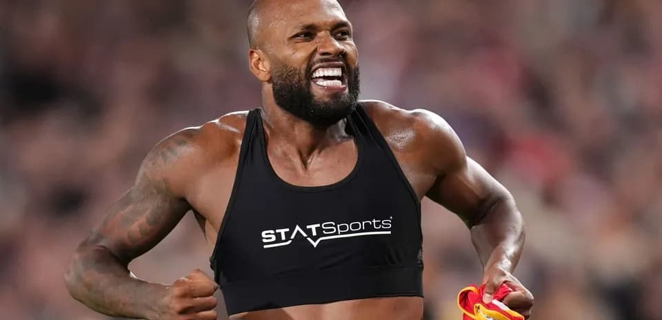 Athlete celebrating with a sports vest after performance