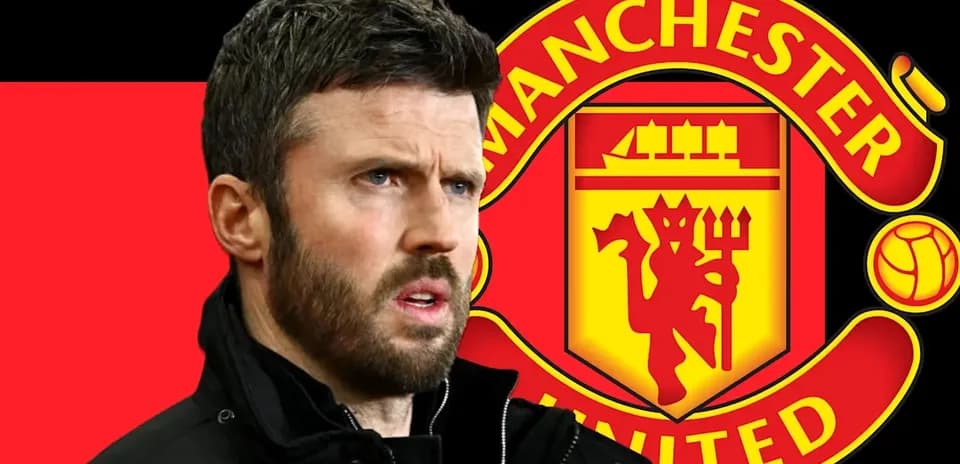 Coach in front of Manchester United logo backdrop