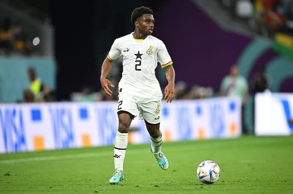 Ghana player dribbling the ball during match