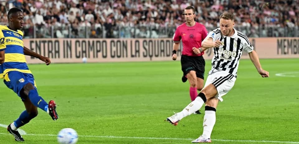 Juventus player kicking the ball against Parma