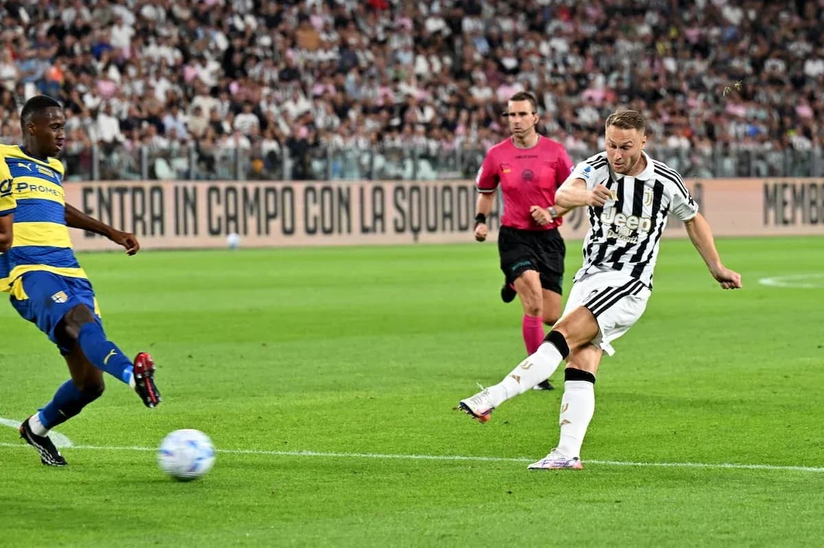 Juventus player kicking the ball against Parma