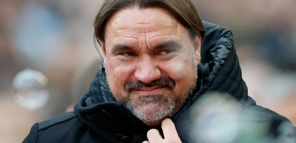 Man with long hair and beard wearing black jacket
