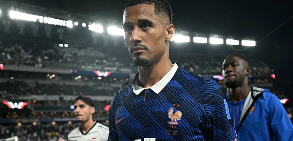 Player in blue jersey walking off the pitch