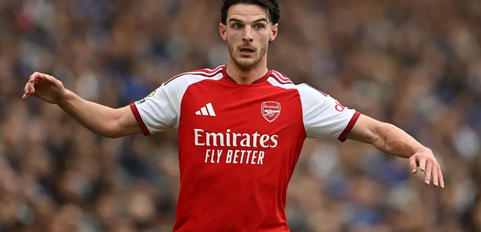 Player in Arsenal kit signaling during match