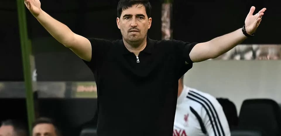 Coach gesturing from the sideline during match