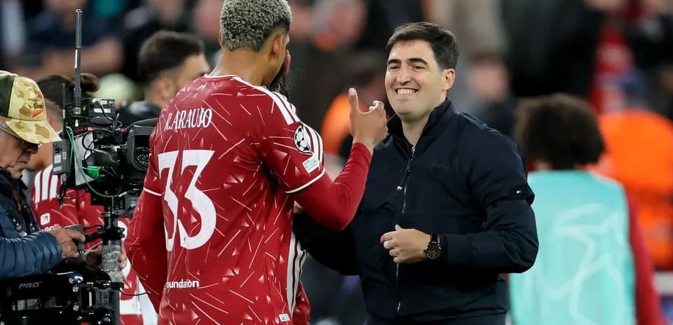 Player embracing coach during match substitution