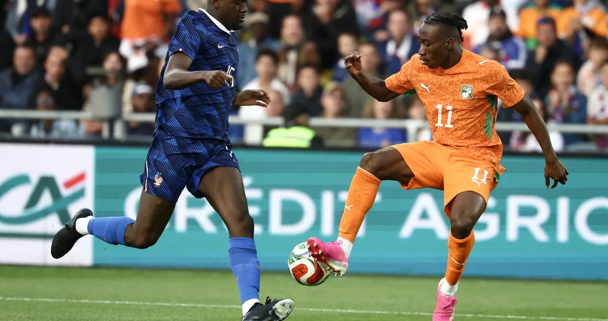Player from France and Ivory Coast battling for the ball