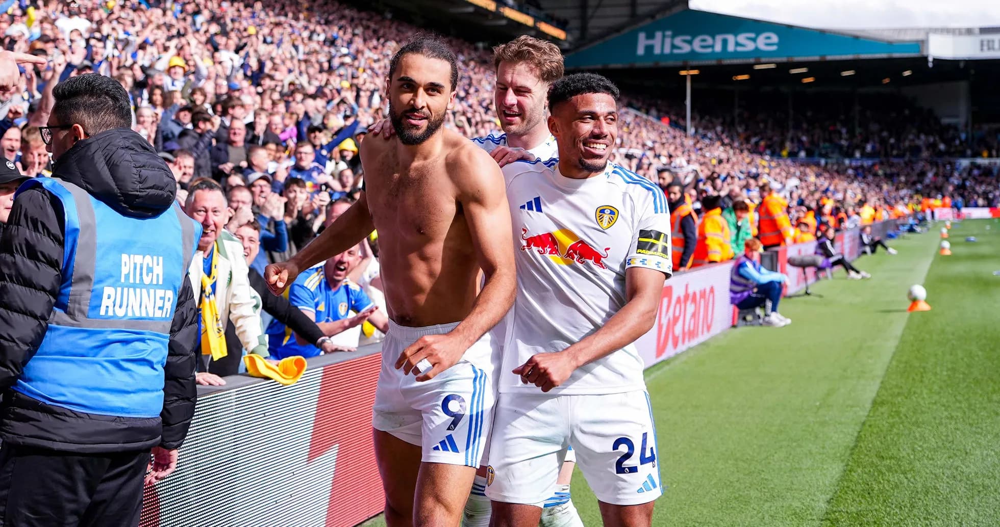 Leeds players celebrating a goal with fans