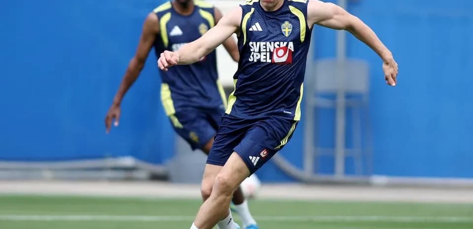 Swedish player kicking a football during practice
