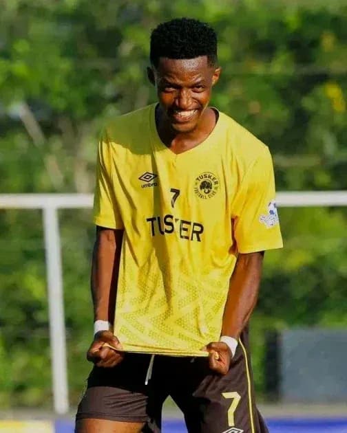 Player celebrating in yellow jersey during match