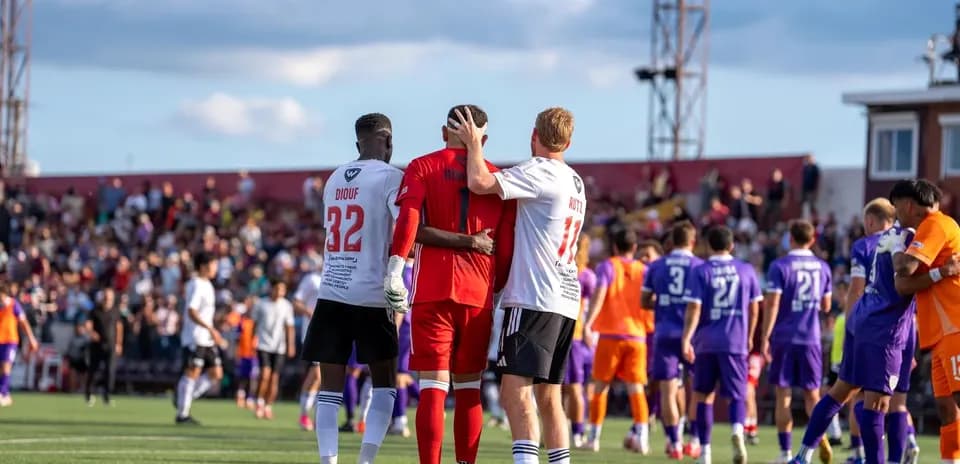 Players celebrating after a USL League One match