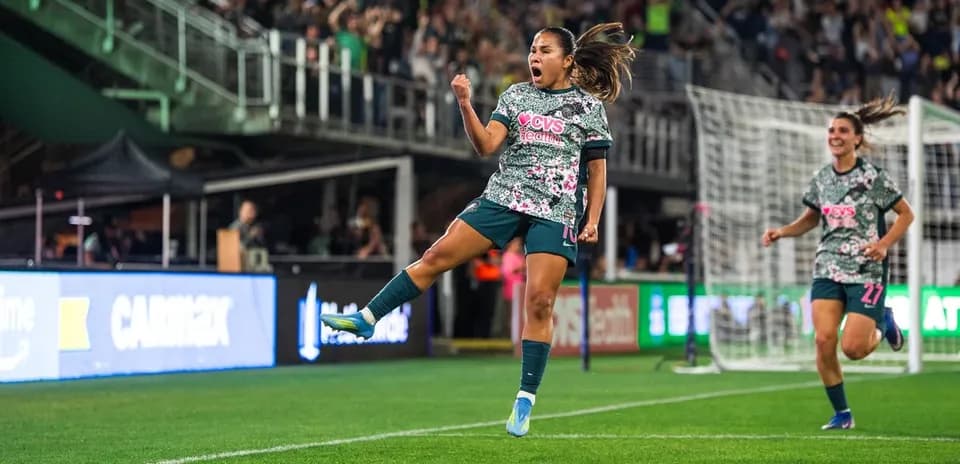 Player celebrating during Seattle Reign FC match