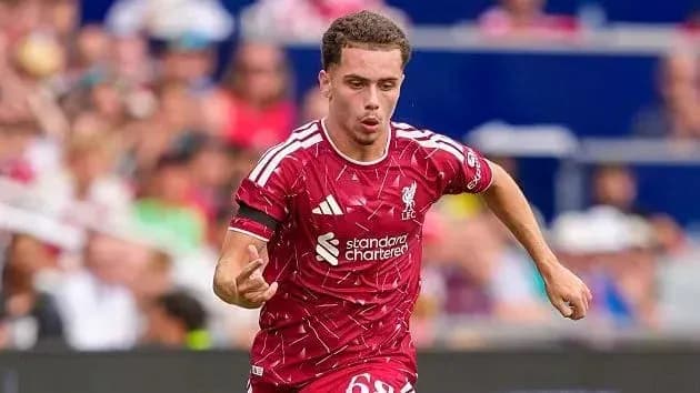 Player in Liverpool kit sprinting on the field