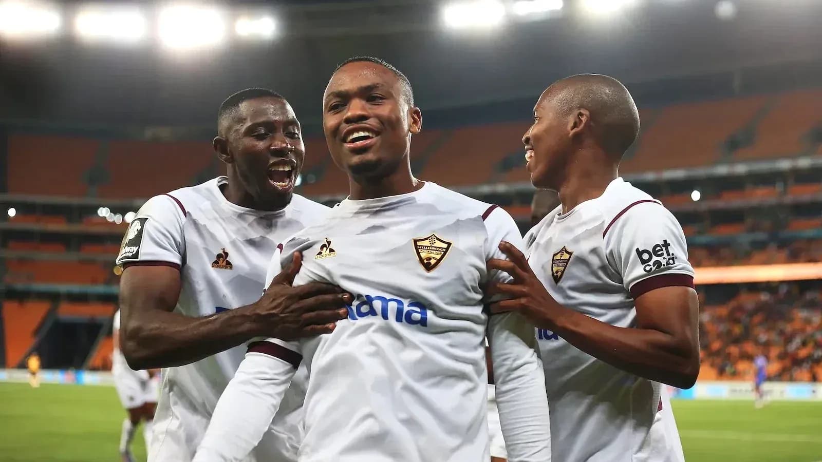 Players celebrating a goal during a match