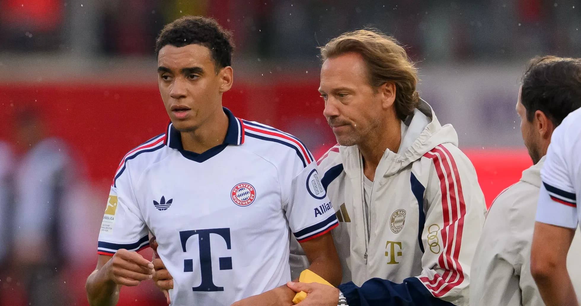 Player and coach discussing on the sidelines