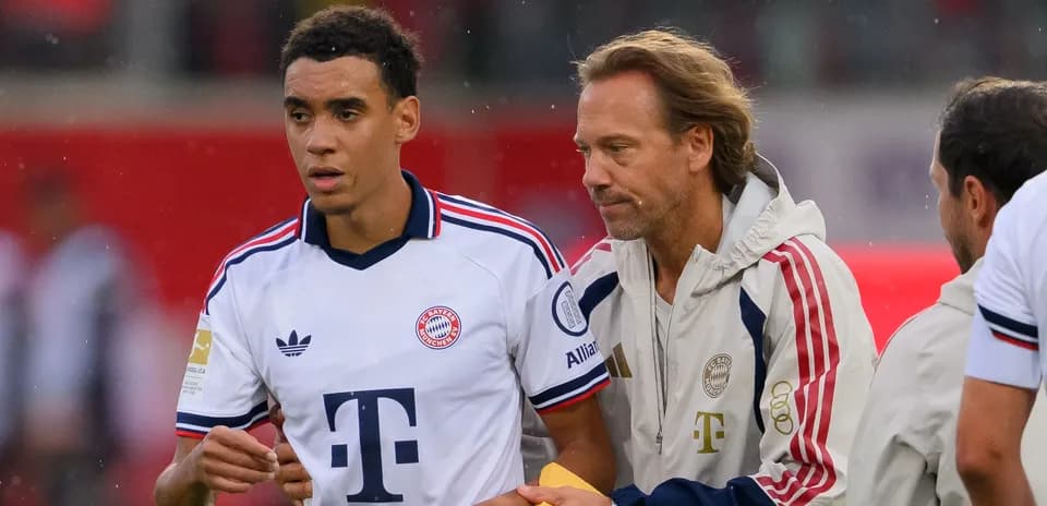 Player and coach discussing on the sidelines