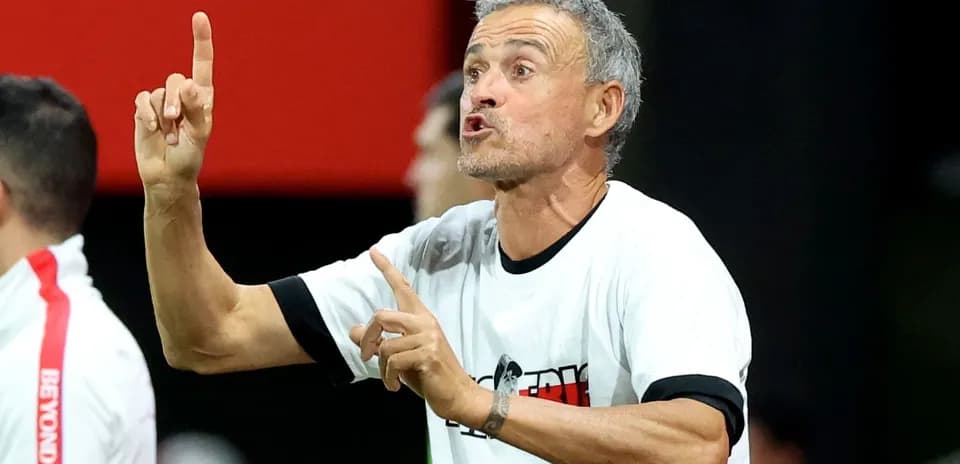 Coach giving instructions on the sidelines