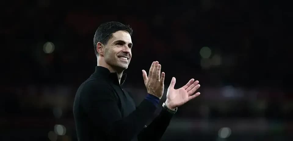 Manager applauding fans after a match
