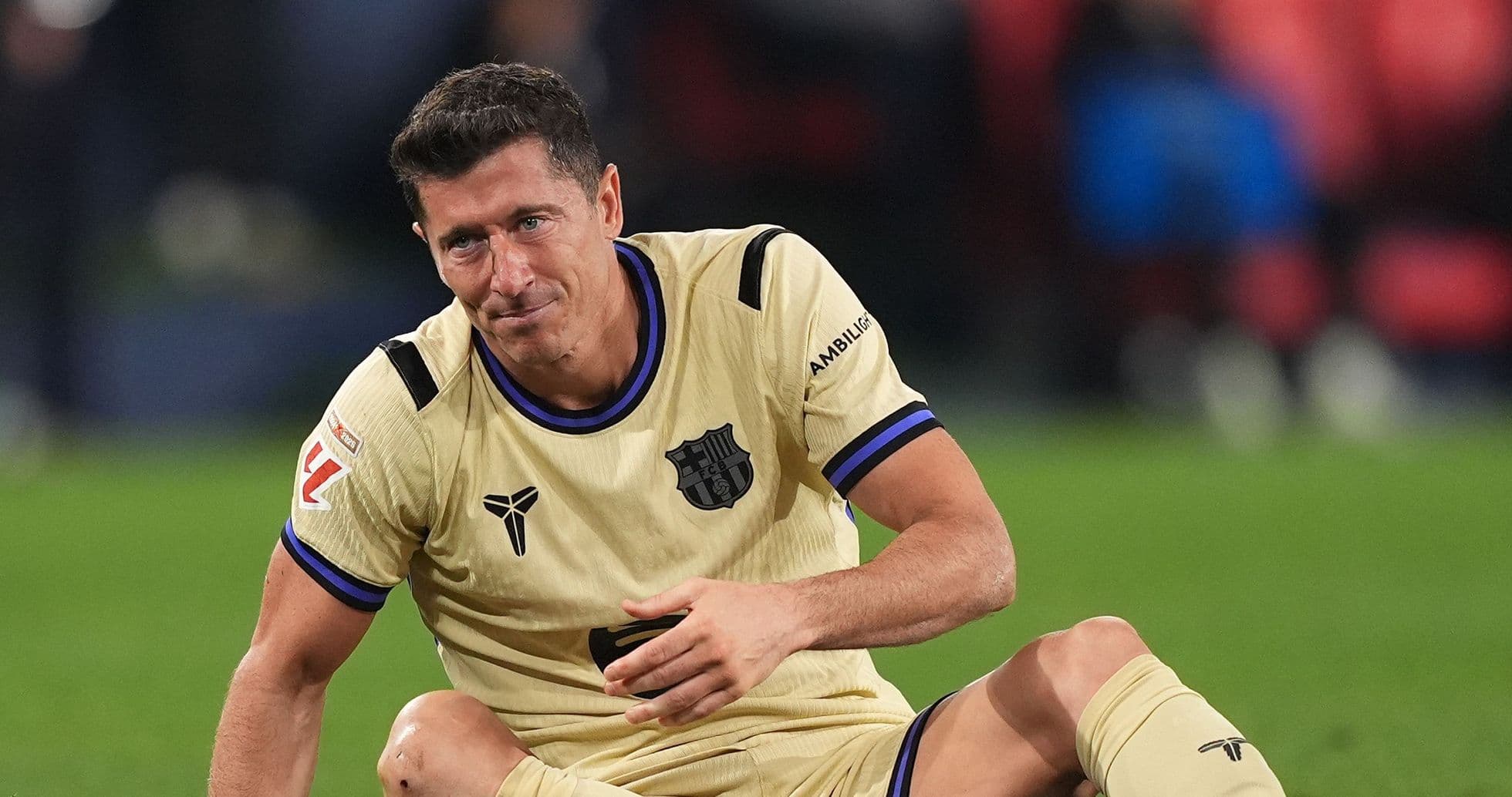 Player sitting on the pitch after a fall