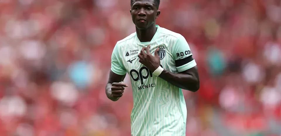 Player in light green jersey during match action
