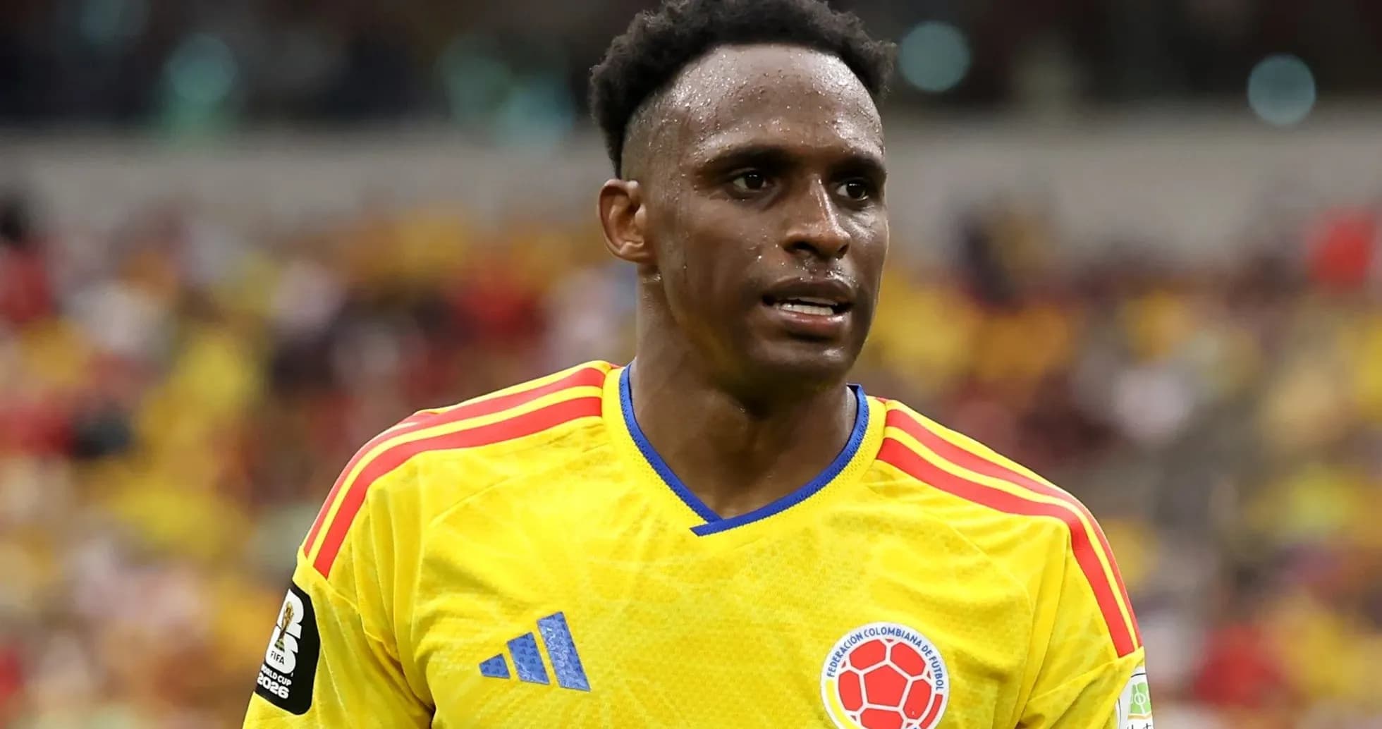 Colombian player in yellow jersey during match