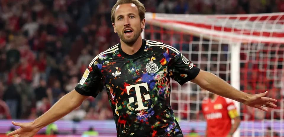 Player celebrating goal in colorful jersey during match
