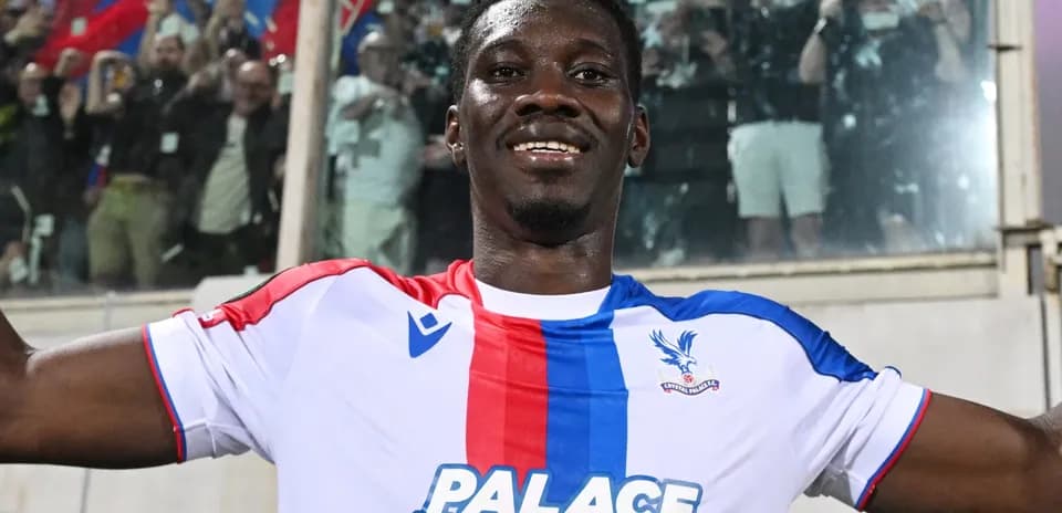 Player celebrating with fans after scoring a goal