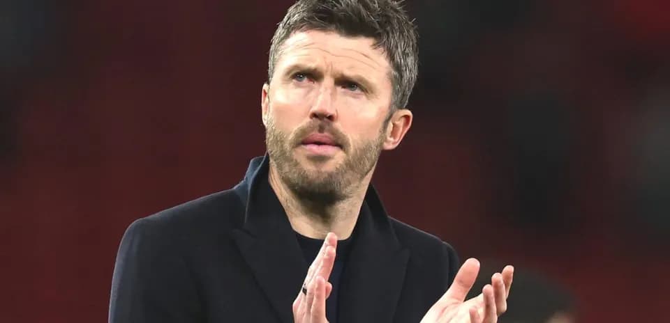 Coach clapping during a match at the stadium